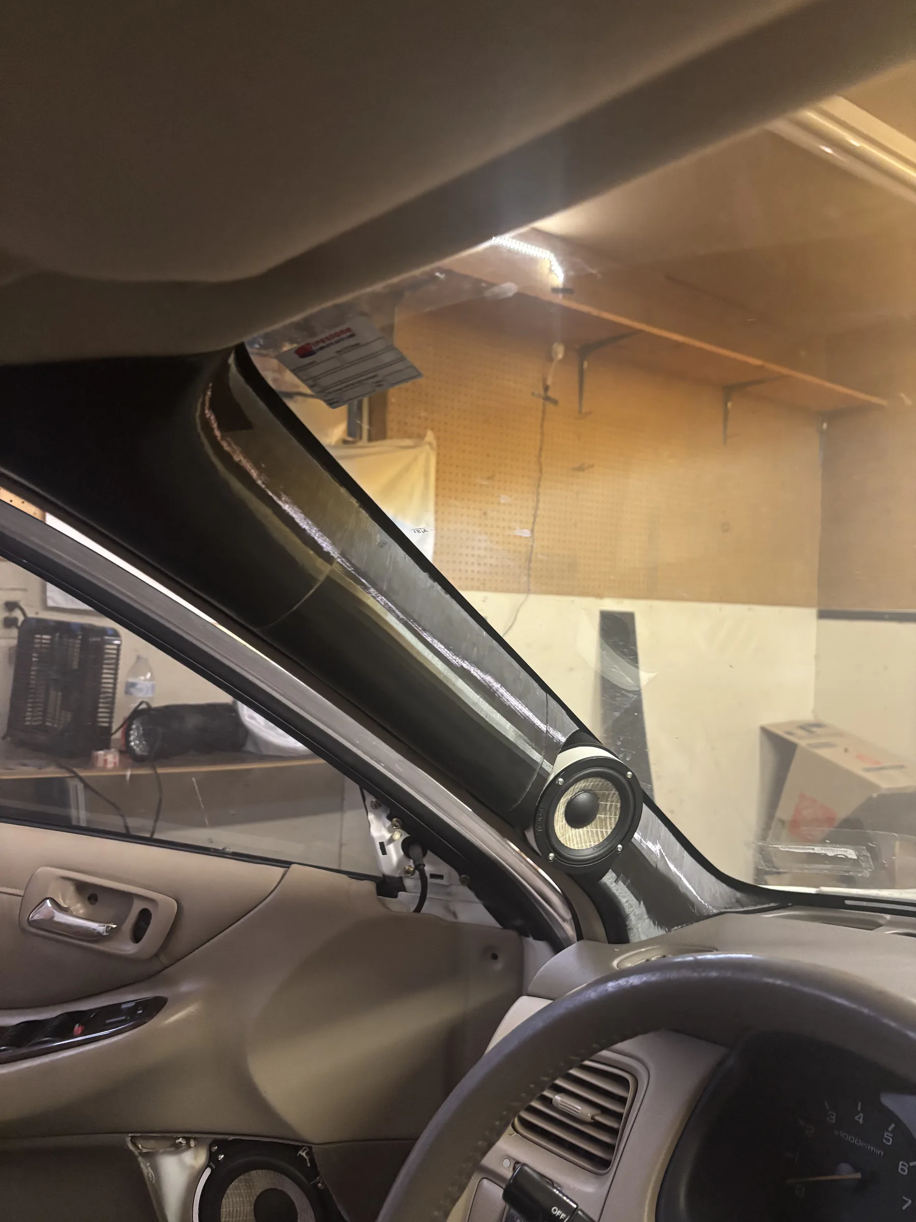 Physical midrange-positioning mockup mounted at the A-pillar of a 2001 Honda Accord.