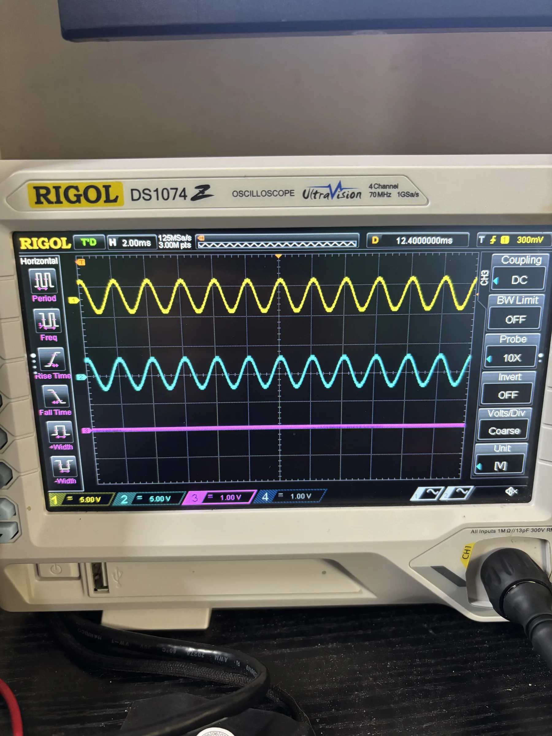 Oscilloscope display showing multiple waveforms measured during DSP Revision 2 bring-up.