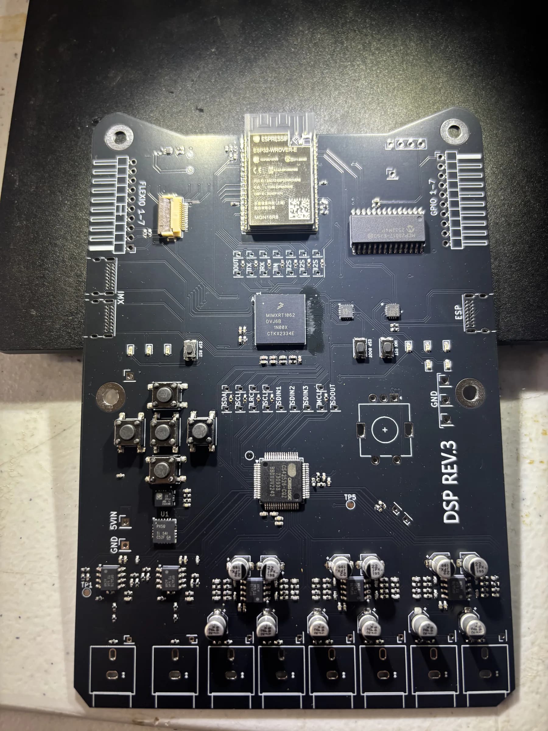 Substantially populated black DSP Revision 3 PCB viewed from above.