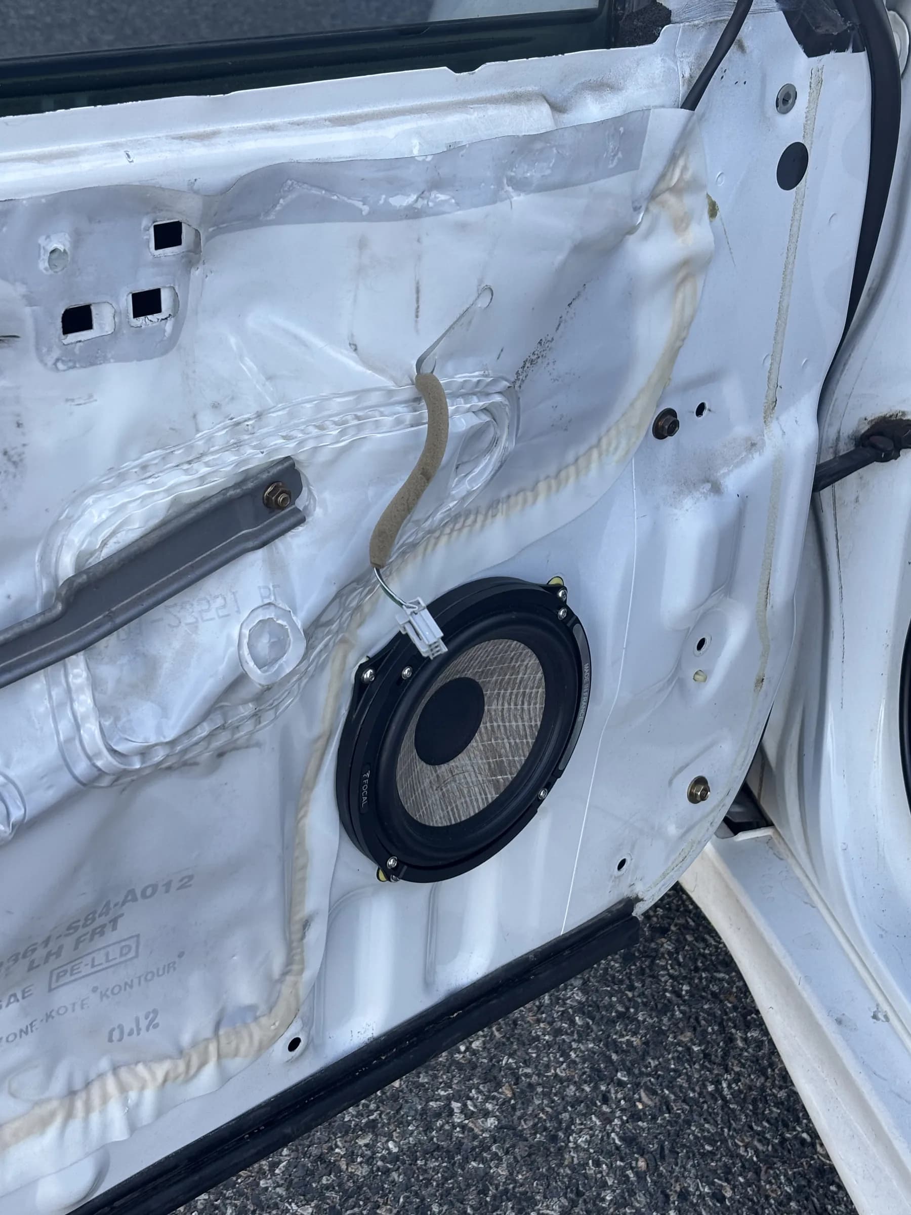 6.5-inch speaker and custom adapter installed inside the Honda Accord door.